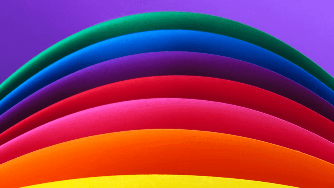 Curved lines forming a rainbow against a purple background used at Warwick Brussels
