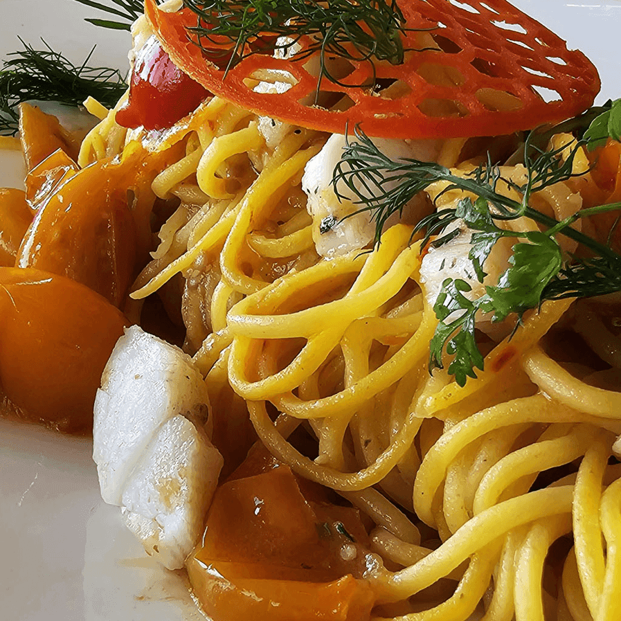 Close-up of a prawn spaghetti served in Osteria 31, one of the best restaurants in Lausanne at Starling Hotel Lausanne