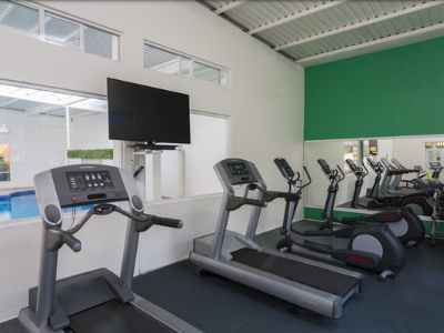 Exercise equipment in the fitness center at Gamma Hotels