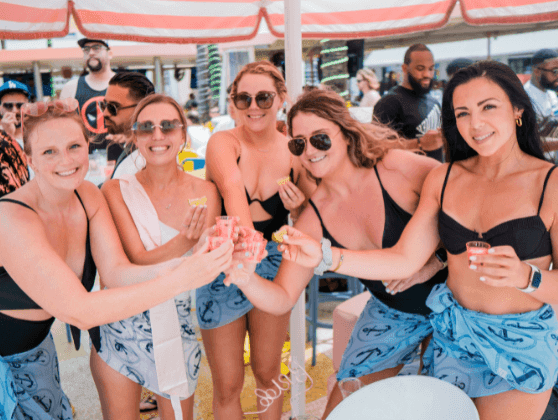 Group of ladies toasting glasses at Clevelander South Beach