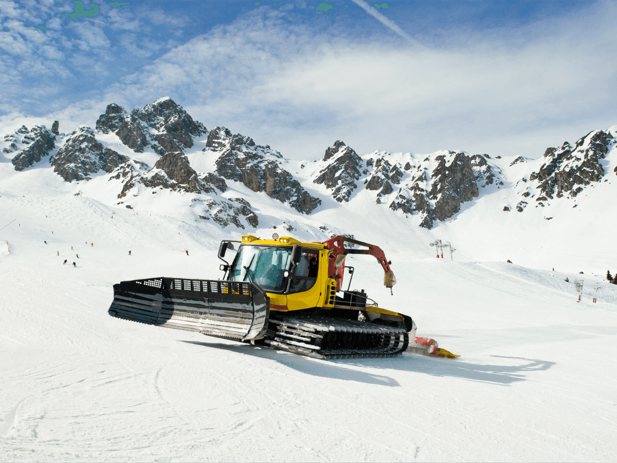 Close-up of a snow grooming machine on snow near Blackcomb Springs Suites