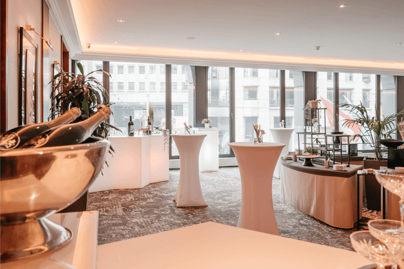 Elegant drink setups, and large windows with a city view in Foyer Mezzanine at Warwick Geneva