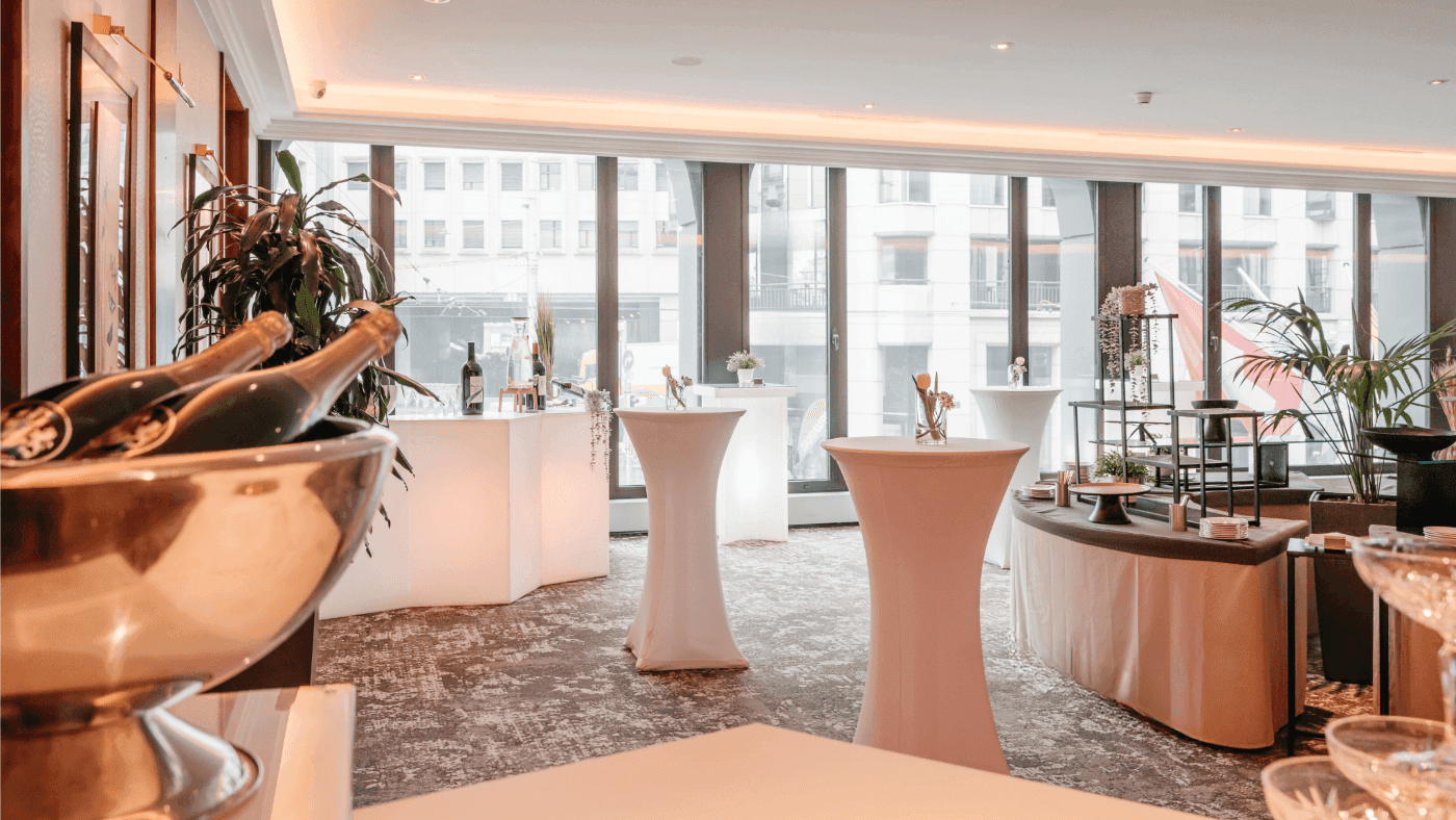Elegant drink setups, and large windows with a city view in Foyer Mezzanine at Warwick Geneva