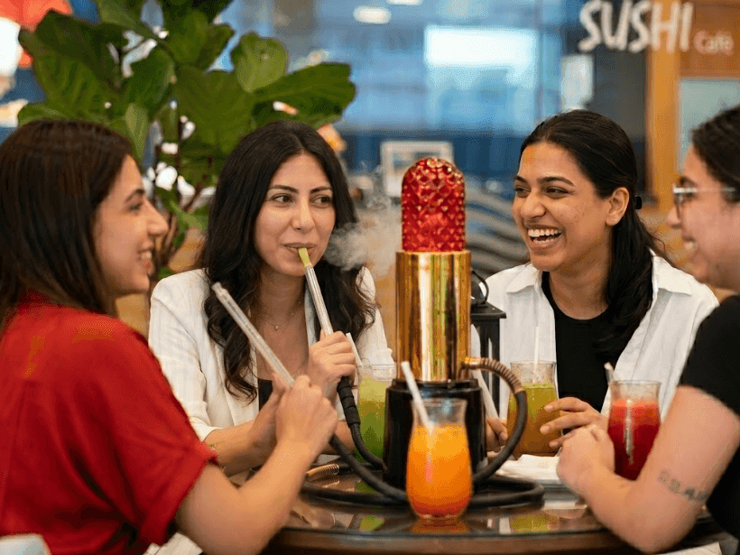 Women enjoying ladies night with drinks and shisha at La Veranda 