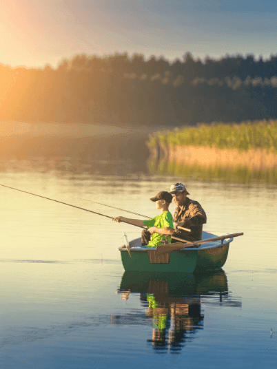 Boy & his father fishing in the lake near The Pearl Hotel