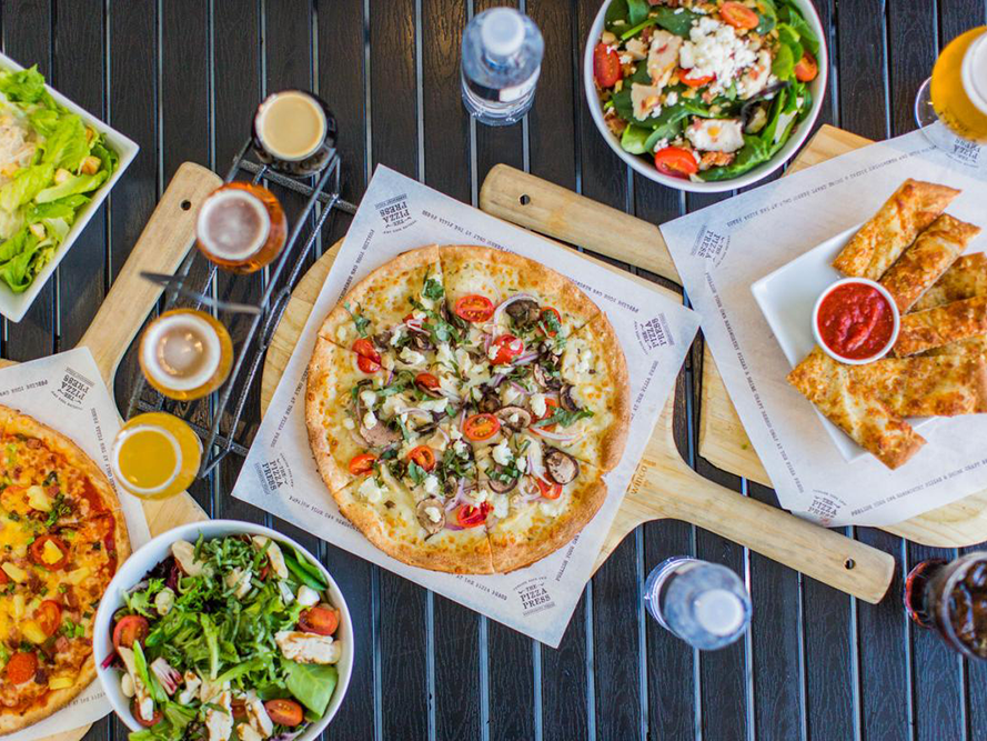 Pizza, salads with garlic bread served at The Anaheim Hotel