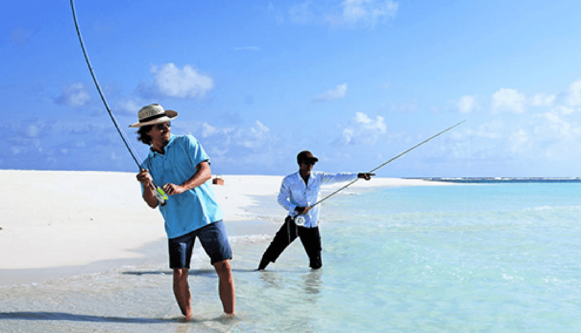 2 men fishing in the sea near The Signature Collection