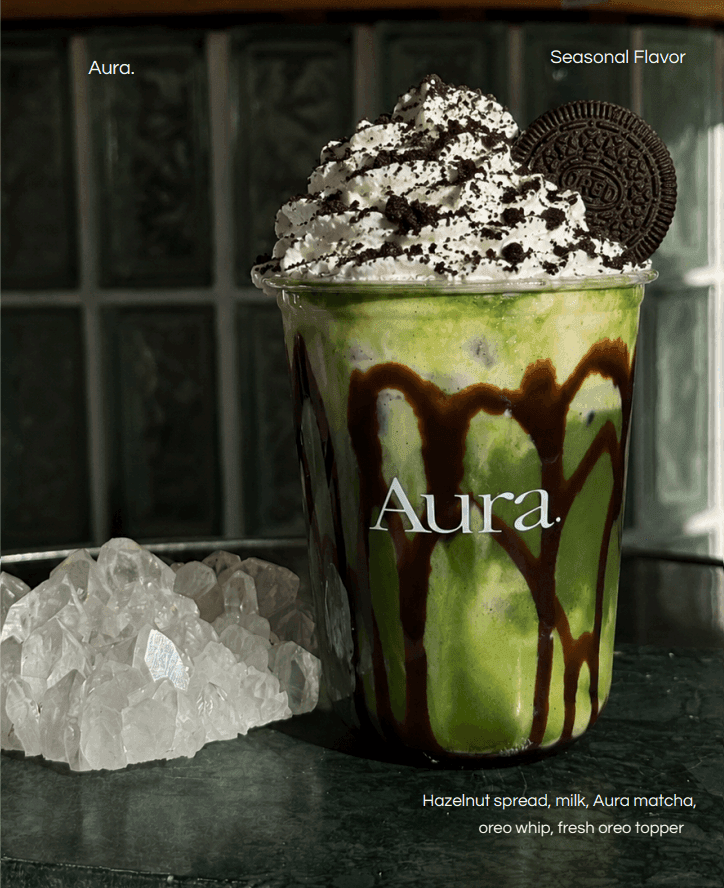 A green drink with whipped cream and an Oreo cookie on top