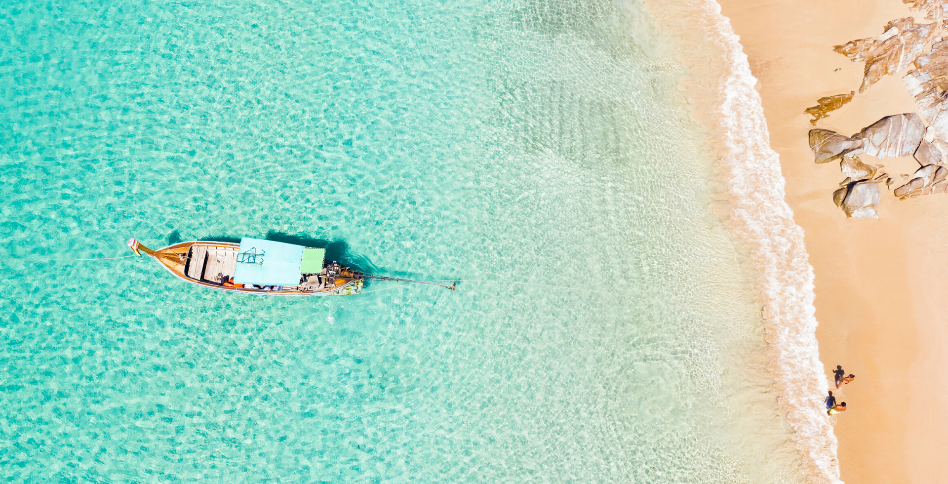 Aerial view of a boat, beach coastline at Amora Hotel