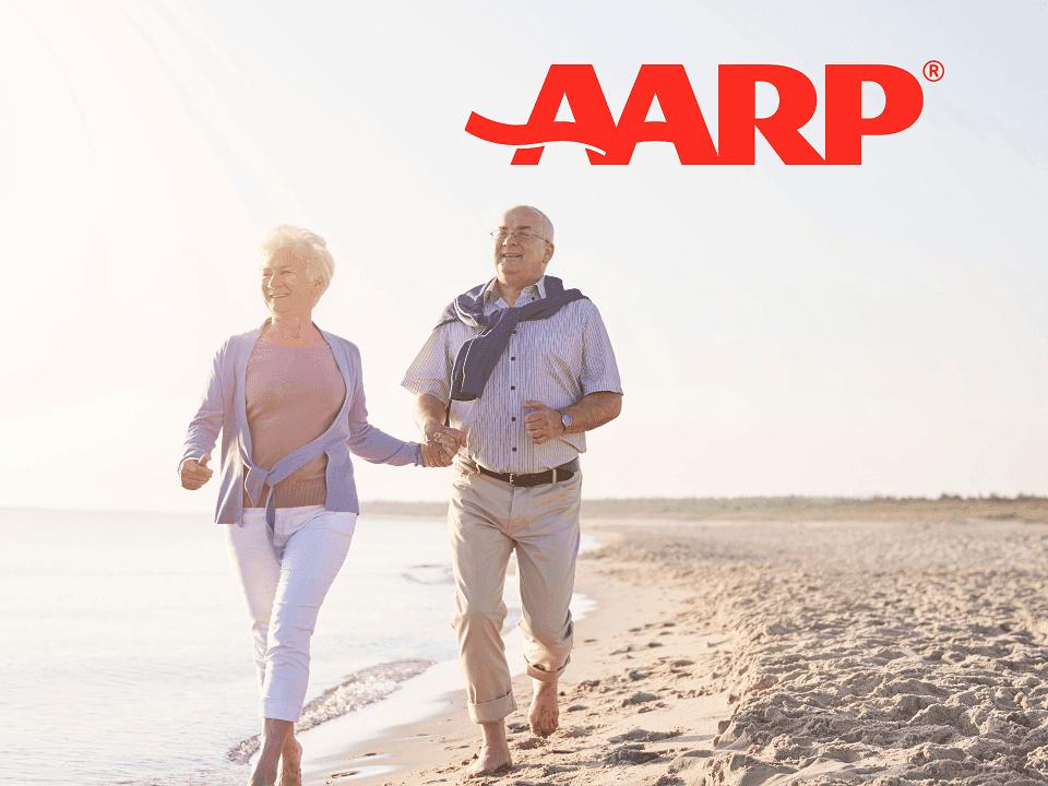 Offer poster with old couple & AARP logo at Costa Beach Resort