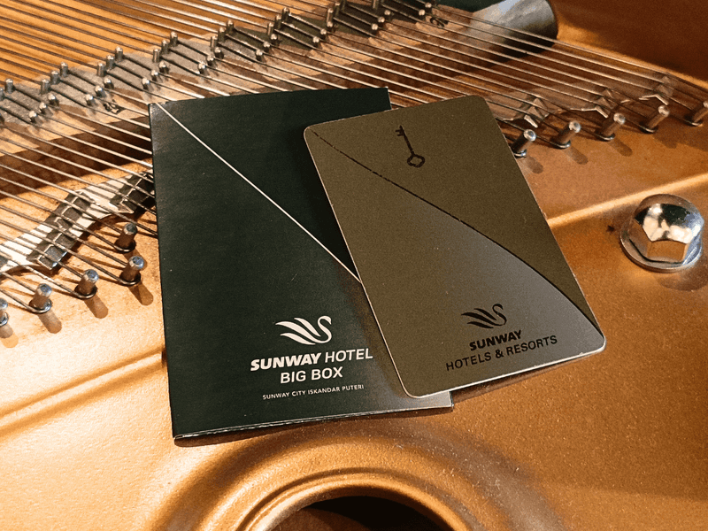 Two Sunway Hotel keycards on a dulcimer musical instrument at Sunway Hotel Big Box