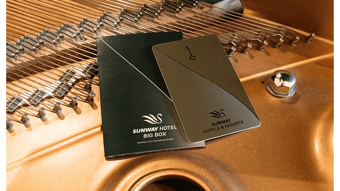 Two Sunway Hotel keycards on a dulcimer musical instrument at Sunway Hotel Big Box