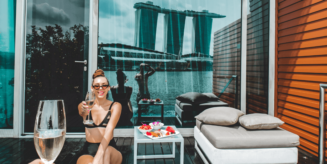 Lady holding a champagne glass at Fullerton Bay Singapore