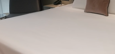 Close-up of a bed in Deluxe Room at VE Hotel & Residence