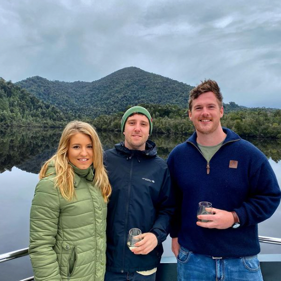 Three people posing on the cruise near Gordon River Cruise