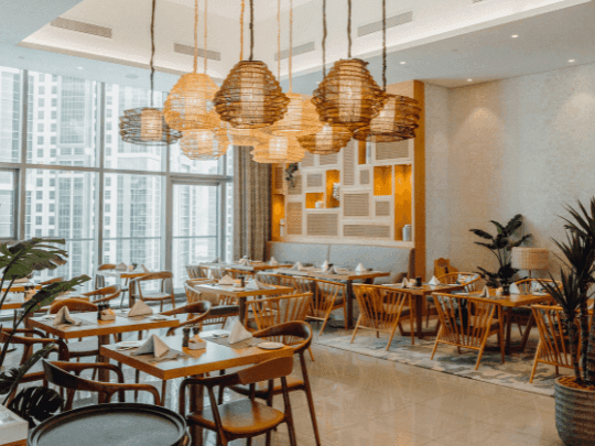 Dining tables arranged in CineScope Restaurant at Paramount Hotel Midtown