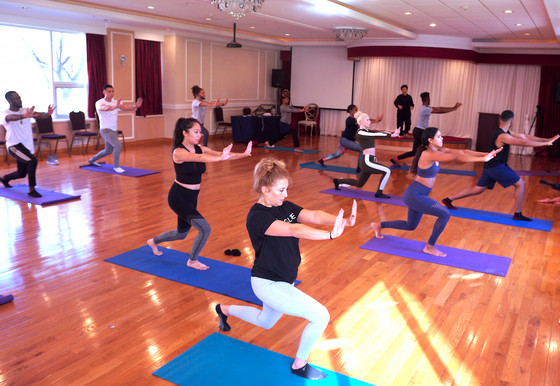 An indoor Healing Qigong session at Honor's Haven Retreat