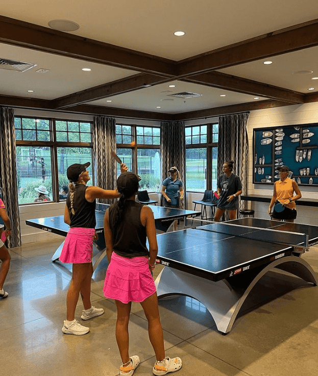 People playing table tennis at Shangri-La Monkey Island