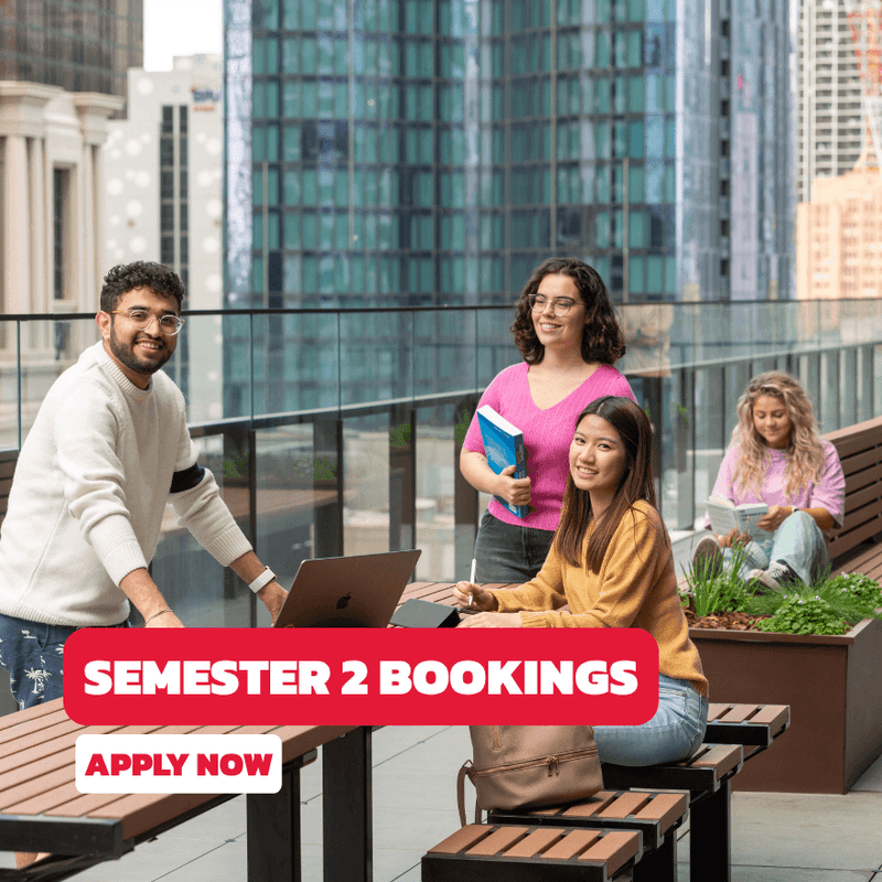 Students studying on a rooftop terrace with city views at UniLodge Melbourne Central.
