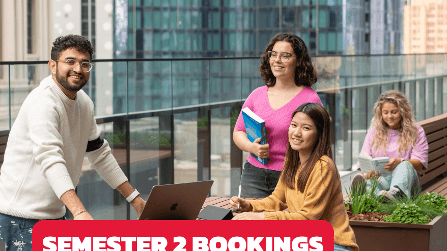 Students studying on a rooftop terrace with city views at UniLodge Melbourne Central.
