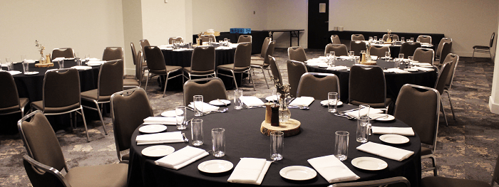 Set up banquets under ceiling lights and carpet floors in Hibiscus at Novotel Sydney International Airport