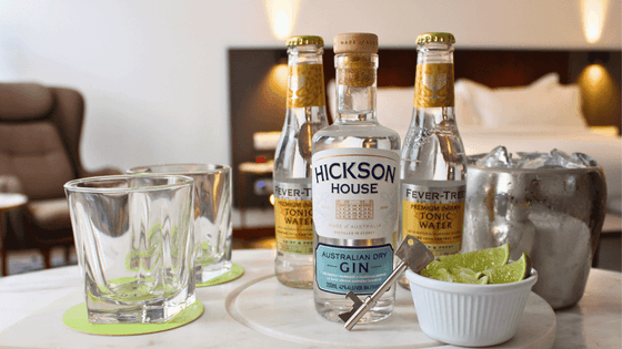 Round table holds Hickson House Australian Dry Gin, two Fever-Tree Tonic Waters, and two glasses served at The Grace Sydney