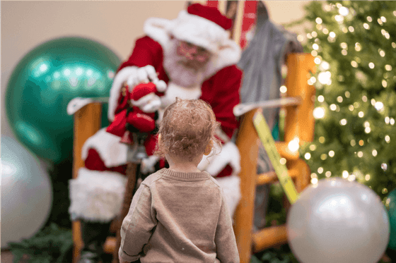 Santa Claus giving gifts to the child at Alderbrook Resort & Spa