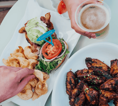 Meat dishes and a drink served at Clevelander South Beach Hotel