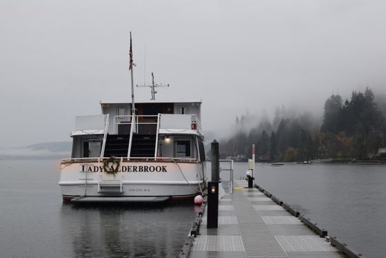 A serene boat floating gently on calm water near Alderbrook Resort & Spa