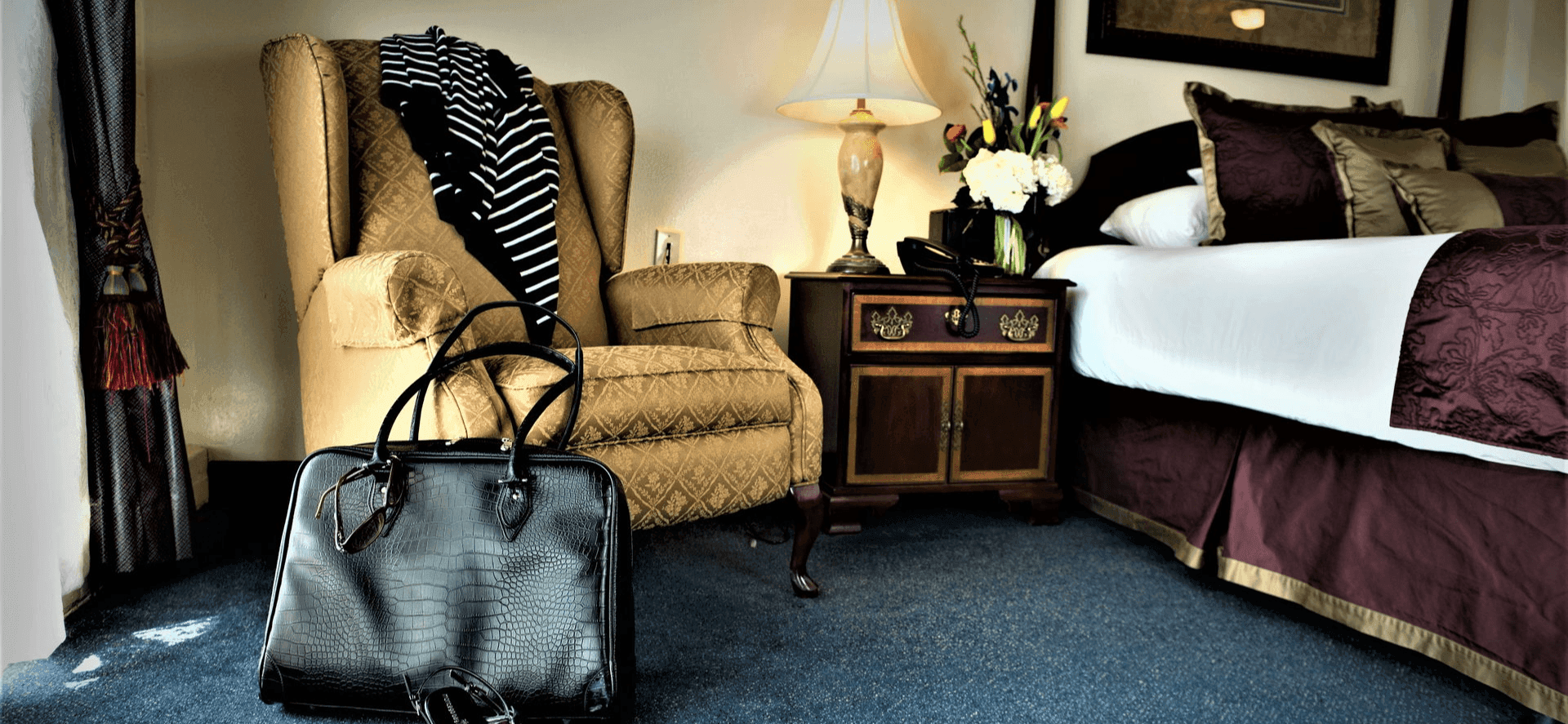 Extended Stay King Studio with briefcase and shoes at Hotel at Old Town Wichita