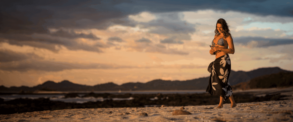 women at the beach sunset