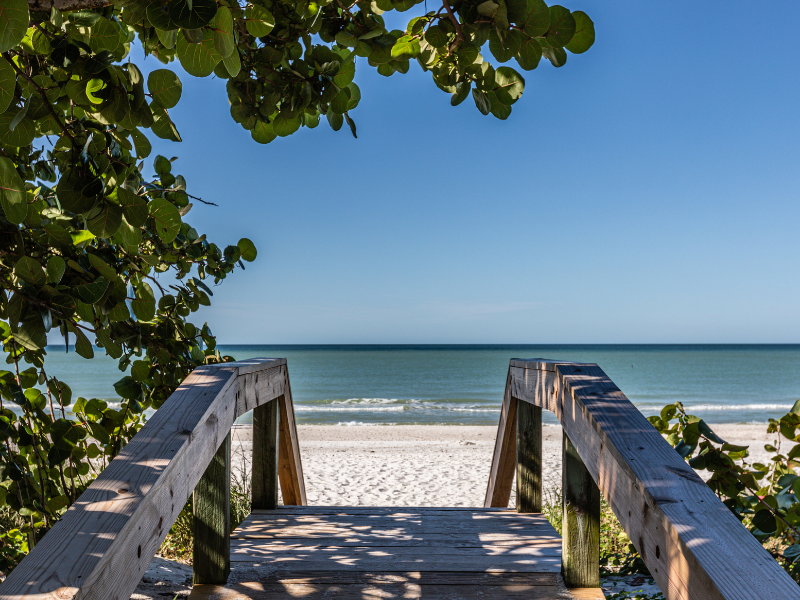 Visit the Naples Beach near the Cove Inn Hotel in Naples Bay, Florida.