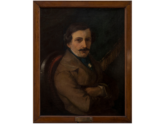 An ancient portrait of a man sporting a mustache and brown coat at Bettoja Hotels Group