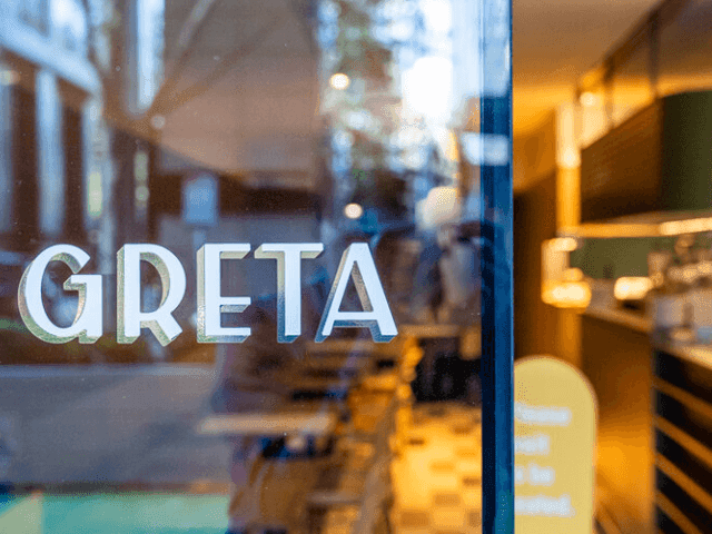 Close-up of front door with Greta sign at Brady Apartment Hotel Flinders Street