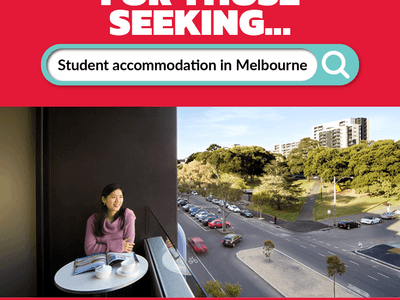 Woman relaxing at table on balcony overlooking busy street and park in Melbourne at Student Living D1.