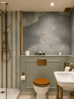 Elegant bathroom with striped shower, brass fixtures, and decorative mirror in One Bedroom Apartment at The Capital Hotel, Apartments & Townhouse - London