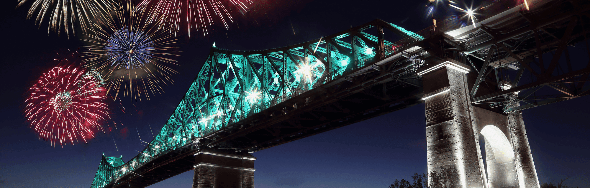 Colorful fireworks explode over bridge near Warwick Le Crystal