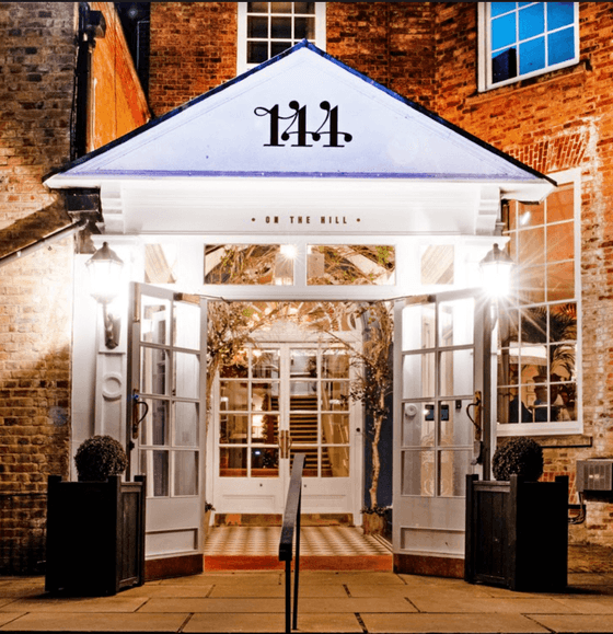 The entrance of Richmond Hill Hotel at night