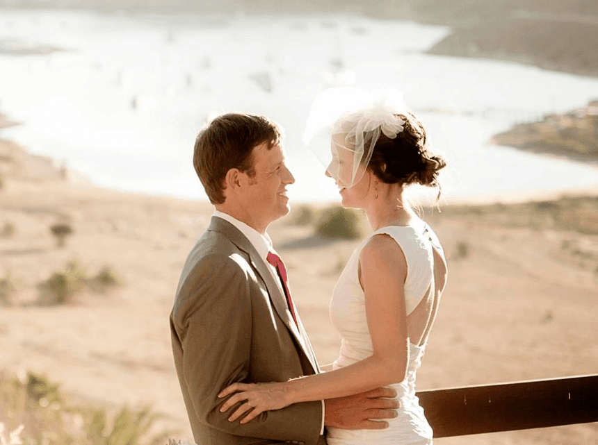 Newly wedded bride & groom posing on the balcony at Catalina Island Company