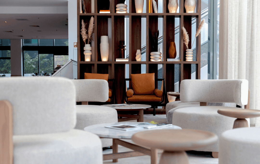 Interior Lobby area with sofas & tables at Amora Hotel Brisbane