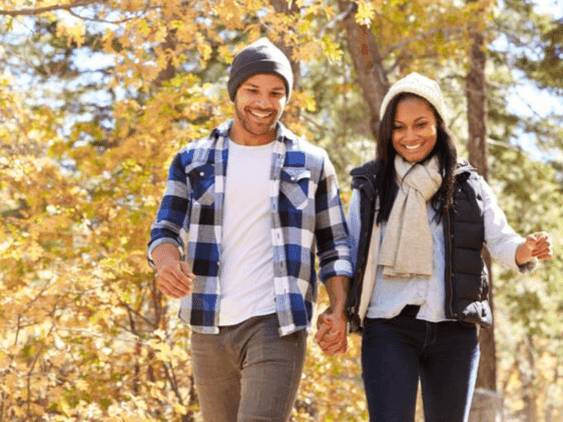 A couple walking near Mystic Dunes Resort