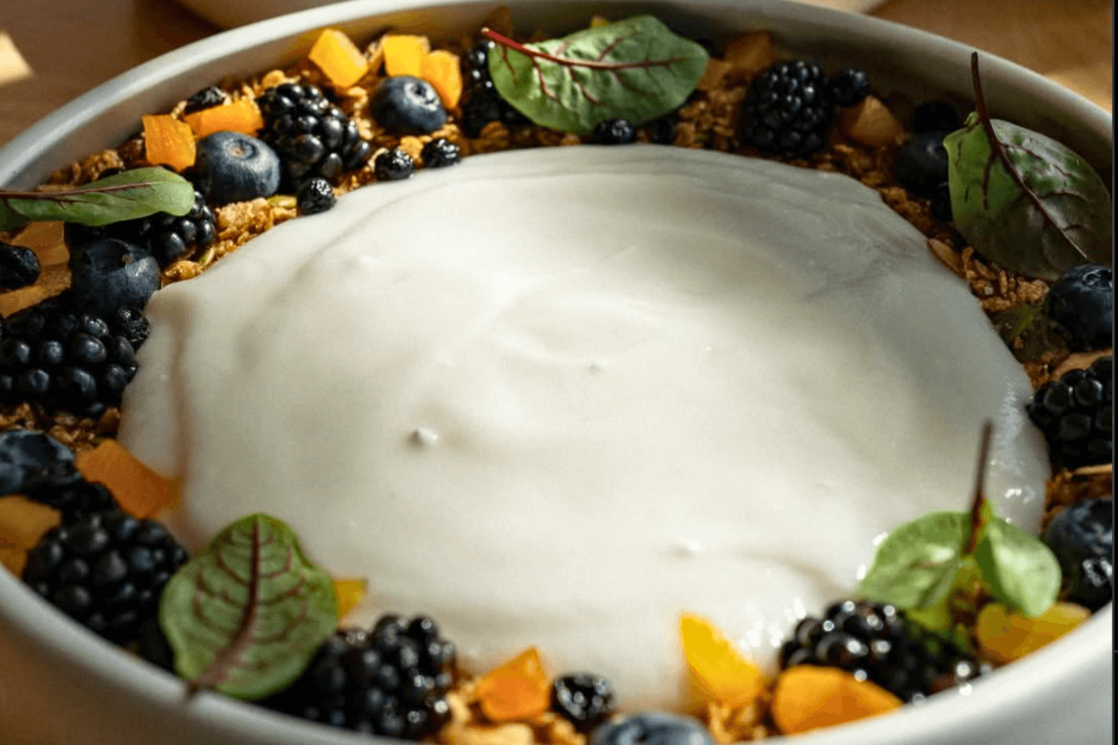 In house made coconut yourgut with filled with berries and fruit