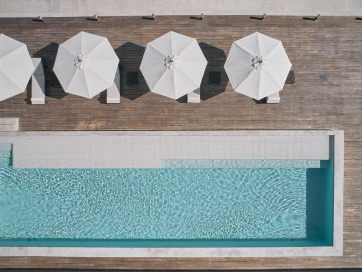 Aerial view of umbrellas by the pool at IOH Freestyle Hotels