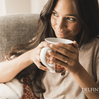 A lady enjoying the morning coffee  at Delfines Hotel