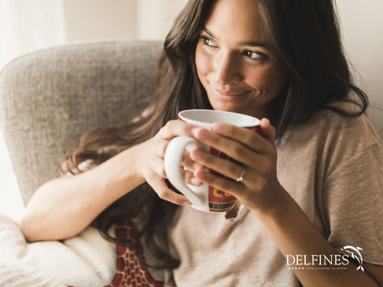 A lady enjoying the morning coffee  at Delfines Hotel