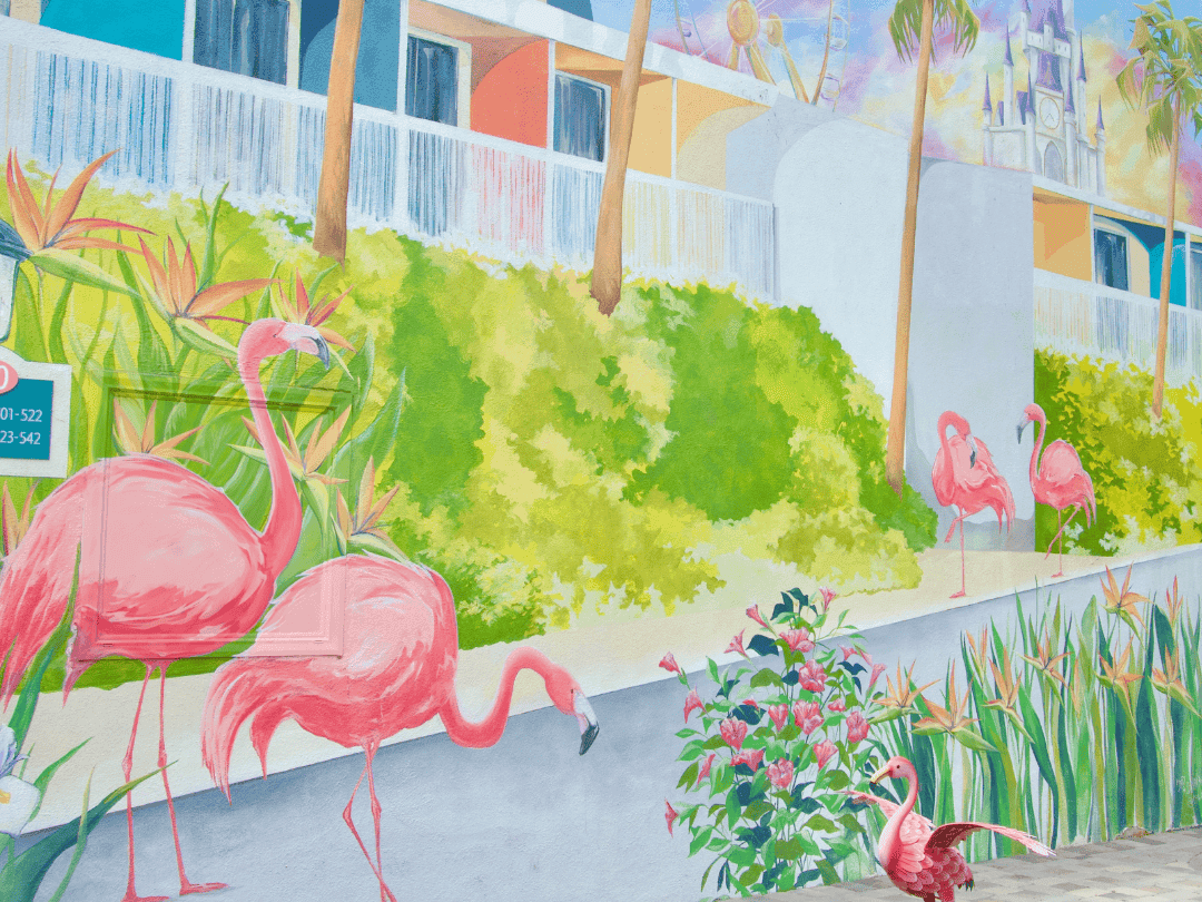 Painted mural wall with flamingoes and hotel scenery