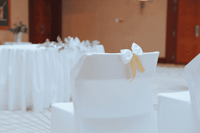 White satin-covered chair in the ballroom at the Almanac X