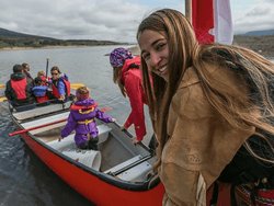 Family getting on a boat near Blackstone Mountain Lodge
