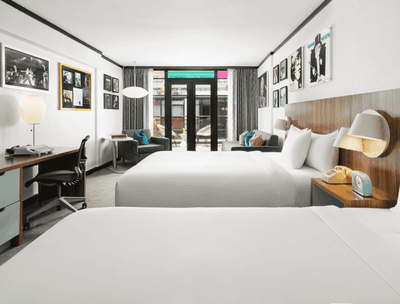 Workspace & lounger by the beds in Deluxe Balcony Queen at The Verb Hotel