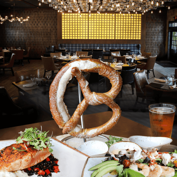 Avalon Brew Pub in Avalon, NJ dining room with salmon, giant pretzel, and cobb salad on the table